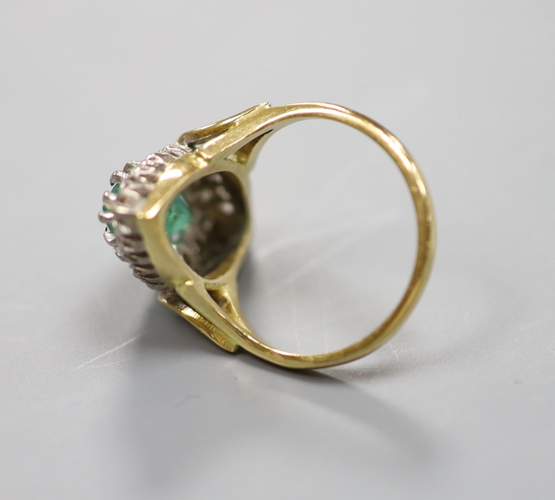 A modern Victorian style 18ct gold, emerald and diamond marquise set dress ring, size L, gross 5.9 grams.